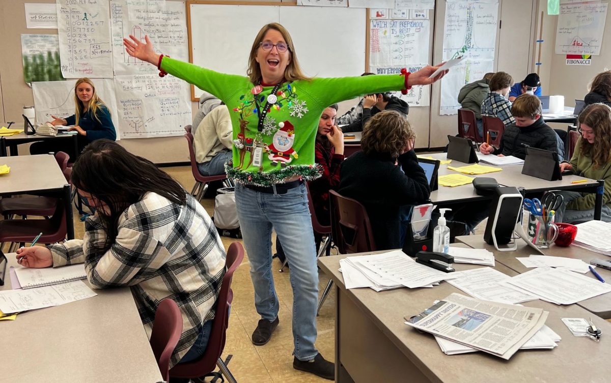 Summit math and computer science teacher Kathy Quick poses in a spirit week costume.