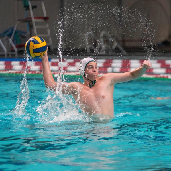 Michel takes a shot during a water polo game against Hood River. / Credit: Cassidy Miller