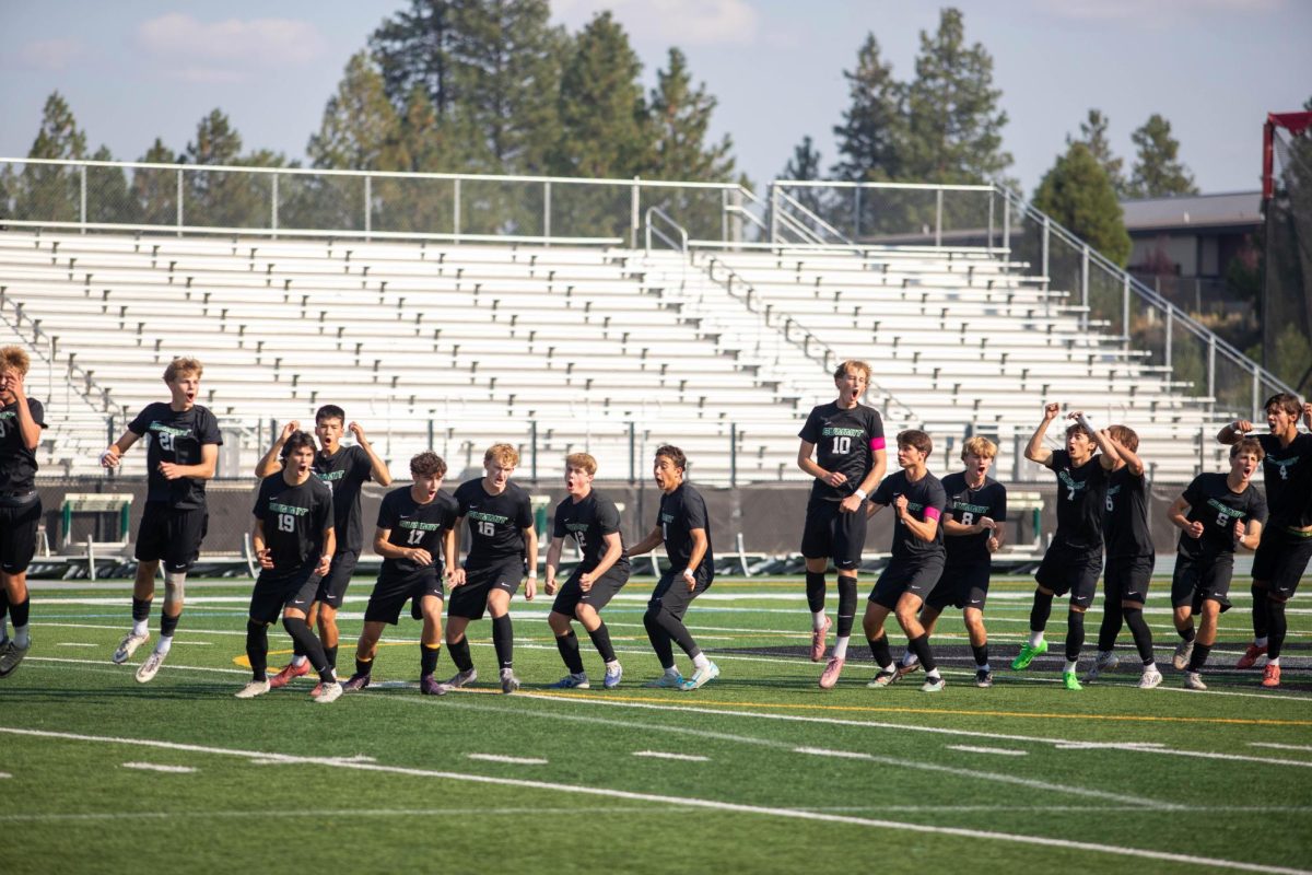 Summit's Boys Varsity Soccer team after the national anthem on Sept. 8. / Photo Credit: Wyatt Wilson