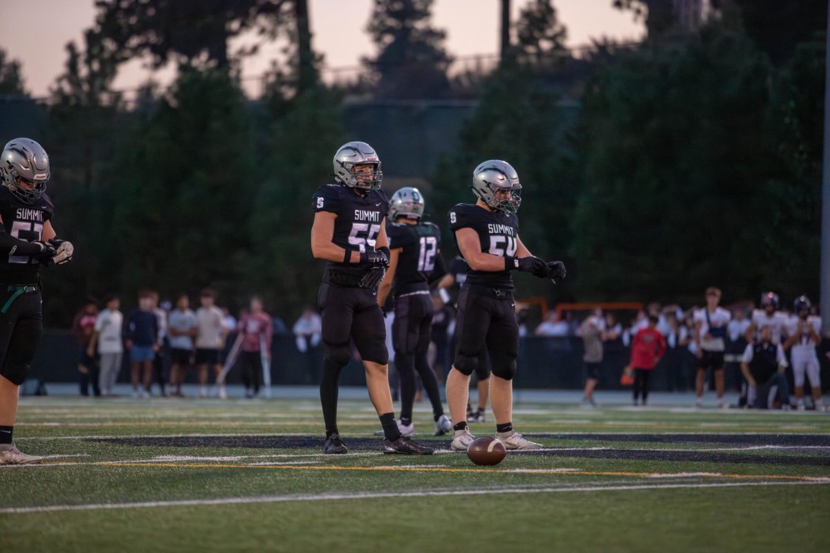 Members of Summit's Varsity Football team photographed at a game on Sept. 19. / Photo Credit: Wyatt Wilson