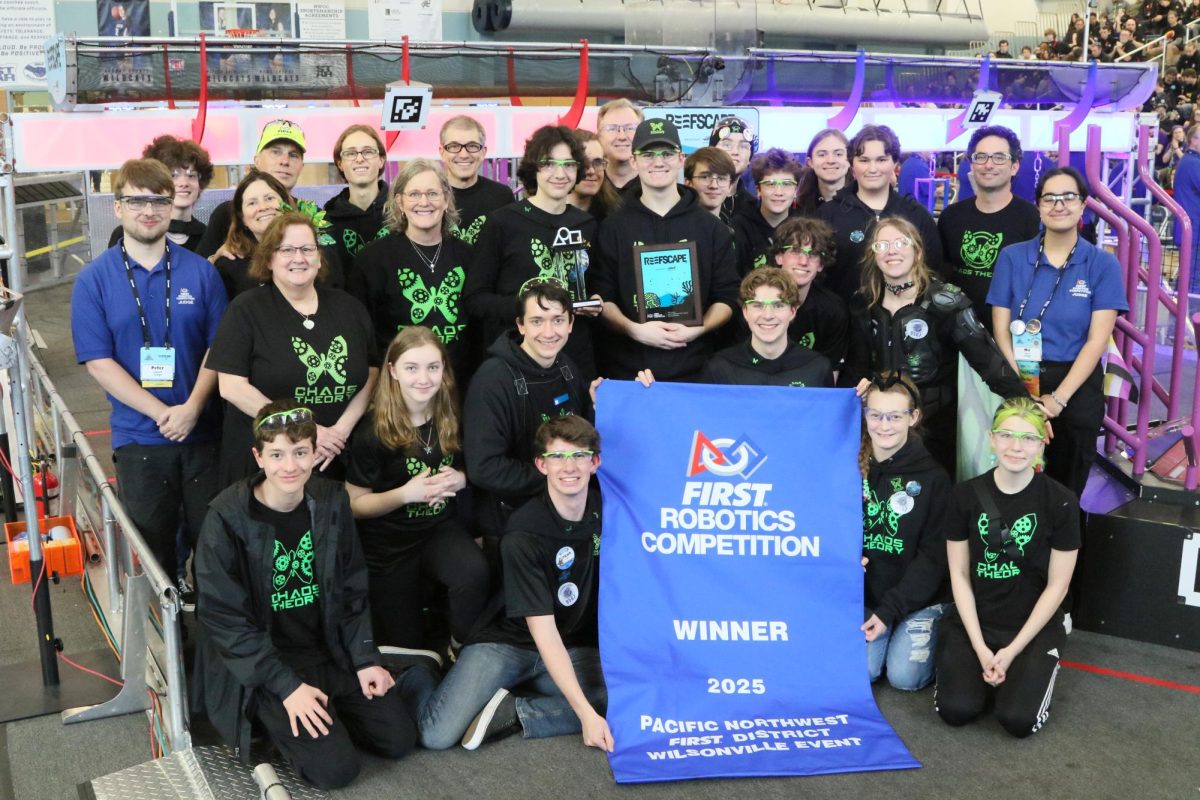 Members of Summit High School’s robotics team, Chaos Theory, pose after a competition win. / Photo Credit: FIRST Washington Photography